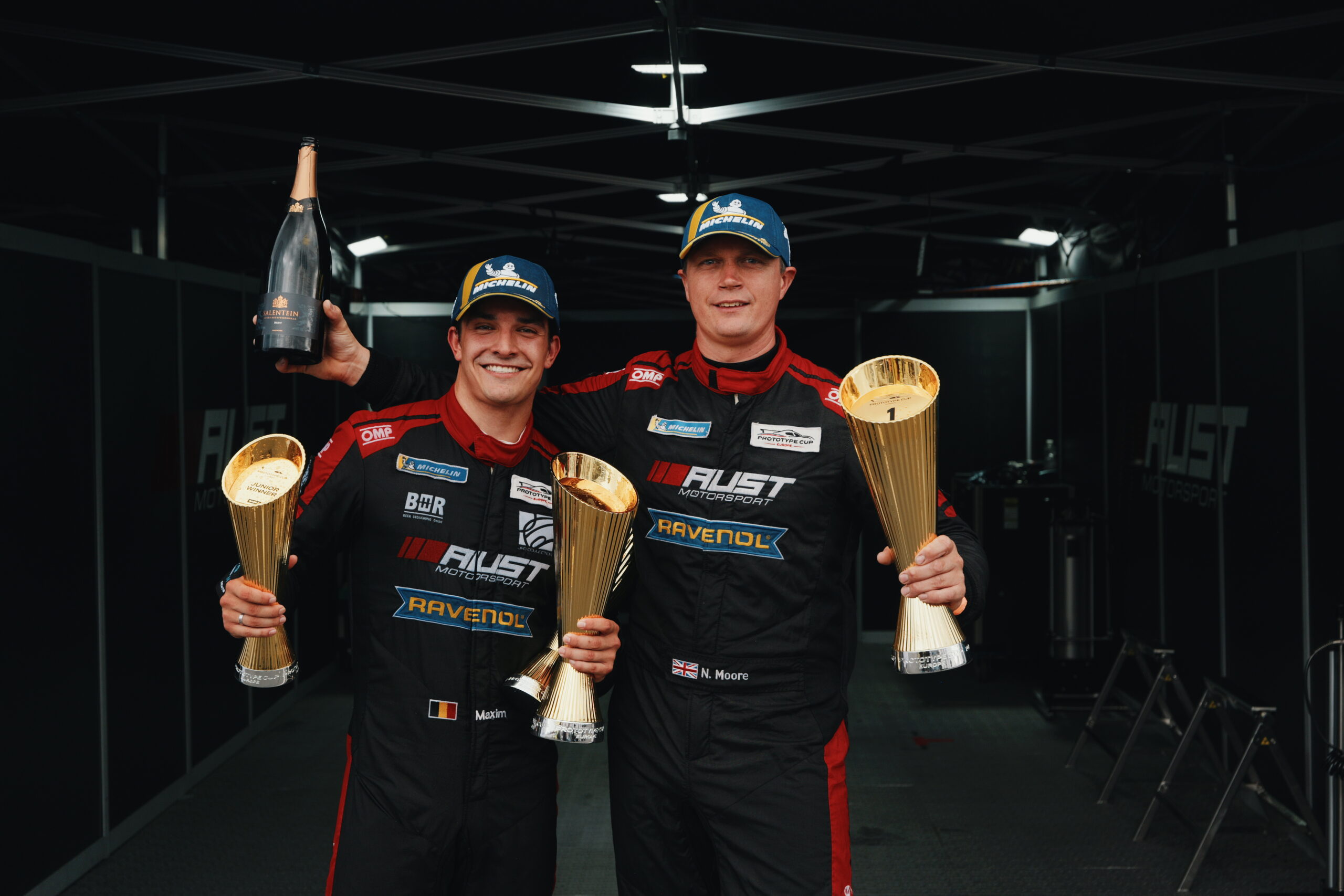 Maxim Dirickx and Nigel Moore with trophies at the tent